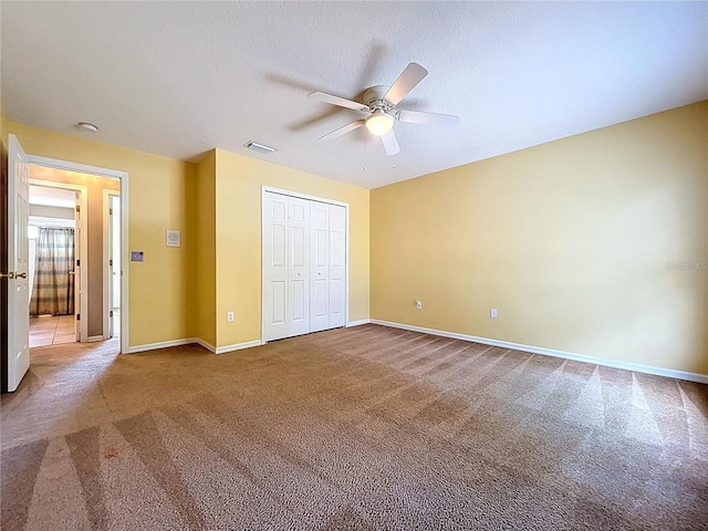 4222 Trumpworth Ct, Valrico, FL 33596 - unfurnished bedroom featuring carpet floors, a closet, and a ceiling fan