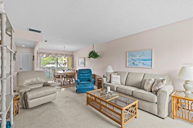 630 Windrush Bay Dr Unit 630, Tarpon Springs, FL 34689 - living area with carpet and a textured ceiling