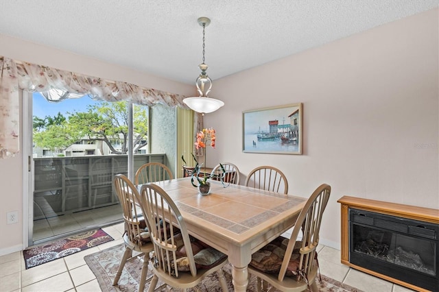 630 Windrush Bay Dr Unit 630, Tarpon Springs, FL 34689 - dining space with light tile patterned floors and a textured ceiling