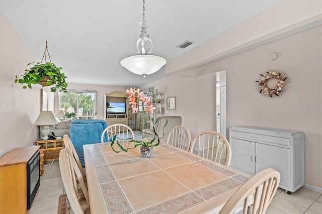 630 Windrush Bay Dr Unit 630, Tarpon Springs, FL 34689 - dining space with light tile patterned floors