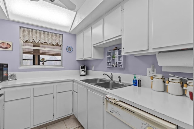 630 Windrush Bay Dr Unit 630, Tarpon Springs, FL 34689 - kitchen featuring white dishwasher, light countertops, white cabinetry, and light tile patterned floors