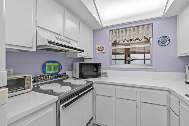 630 Windrush Bay Dr Unit 630, Tarpon Springs, FL 34689 - kitchen featuring black microwave, electric range, under cabinet range hood, and white cabinets