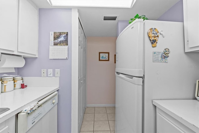 630 Windrush Bay Dr Unit 630, Tarpon Springs, FL 34689 - kitchen with white appliances, light countertops, white cabinets, and light tile patterned flooring