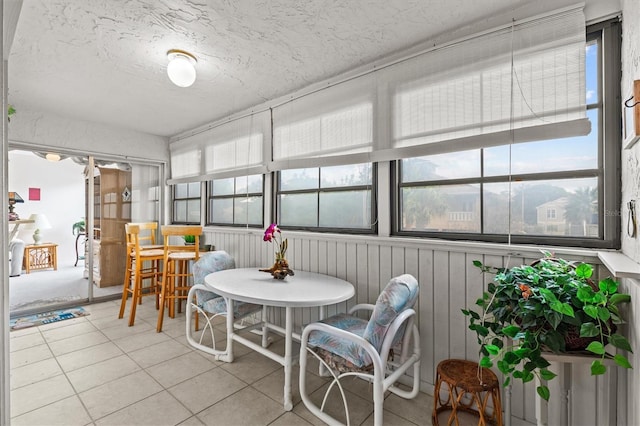 630 Windrush Bay Dr Unit 630, Tarpon Springs, FL 34689 - sunroom with healthy amount of natural light, tile patterned floors, and a textured ceiling