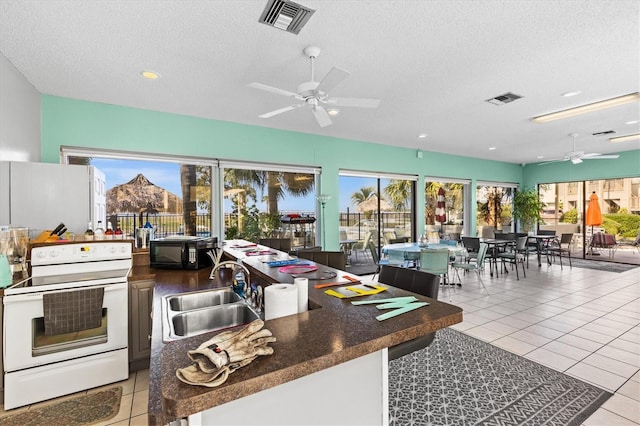 630 Windrush Bay Dr Unit 630, Tarpon Springs, FL 34689 - view of patio featuring ceiling fan and area for grilling