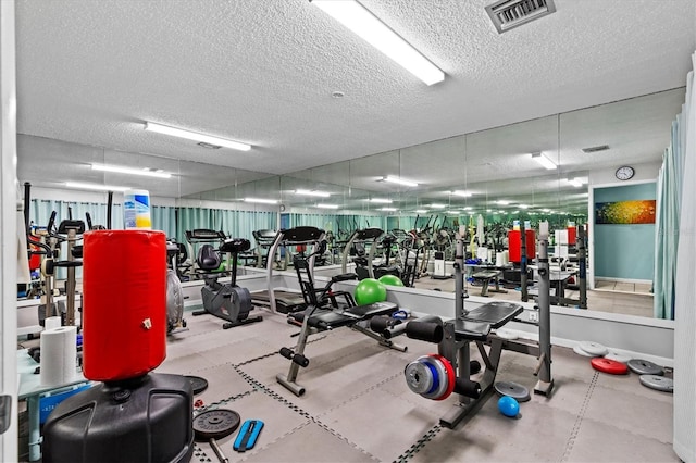 630 Windrush Bay Dr Unit 630, Tarpon Springs, FL 34689 - workout area with a textured ceiling