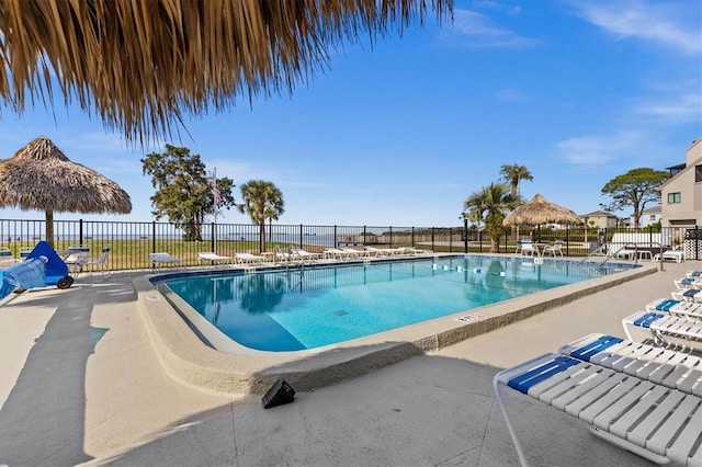 630 Windrush Bay Dr Unit 630, Tarpon Springs, FL 34689 - community pool featuring a patio