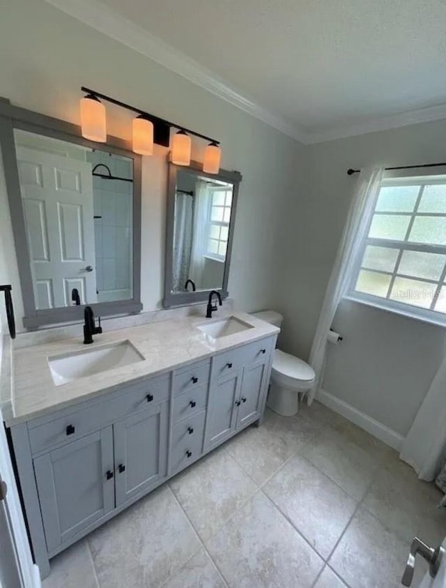 3856 Tarpon Rd, Venice, FL 34293 - bathroom with double vanity, ornamental molding, and tile patterned floors
