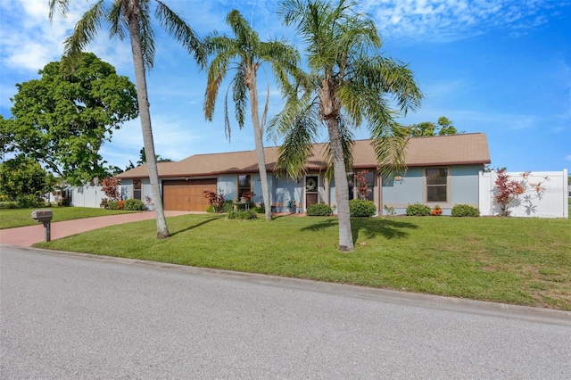 3302 69th St W, Bradenton, FL 34209 - single story home with concrete driveway, an attached garage, and a front lawn