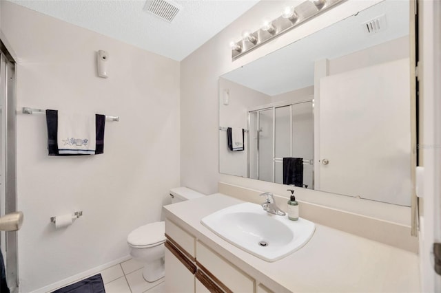 3302 69th St W, Bradenton, FL 34209 - bathroom featuring a stall shower, vanity, tile patterned floors, and a textured ceiling