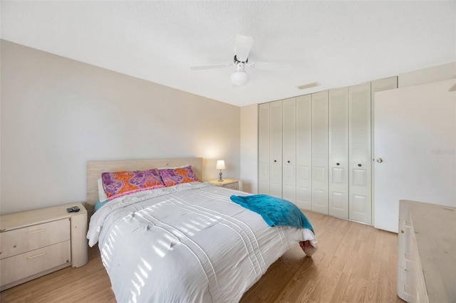 3302 69th St W, Bradenton, FL 34209 - bedroom with light wood-style floors, ceiling fan, and a closet