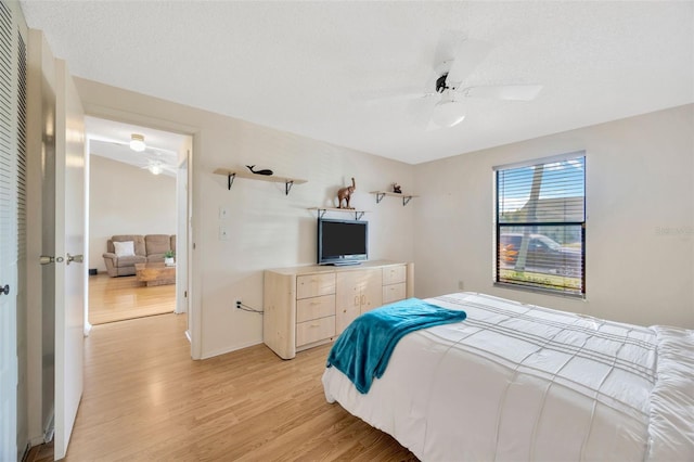3302 69th St W, Bradenton, FL 34209 - bedroom with light wood finished floors and a ceiling fan