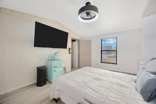 3302 69th St W, Bradenton, FL 34209 - bedroom featuring wood finished floors and vaulted ceiling