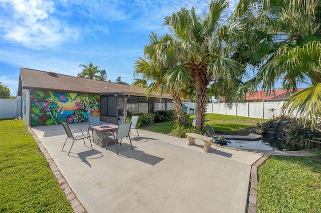 3302 69th St W, Bradenton, FL 34209 - fenced backyard with a patio area, an outdoor fire pit, and a sunroom