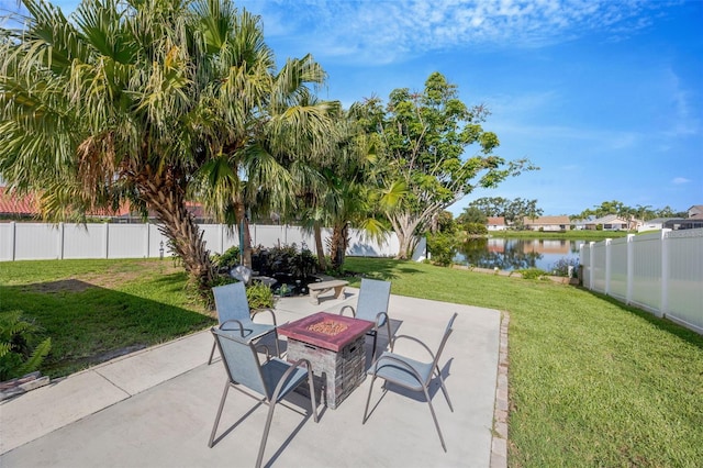 3302 69th St W, Bradenton, FL 34209 - fenced backyard featuring an outdoor fire pit, a water view, and a patio area
