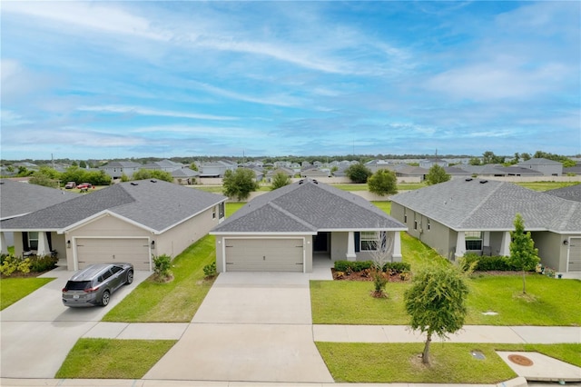 11958 Stone Pine St, Riverview, FL 33569 - view of front facade with a residential view, a garage, and driveway