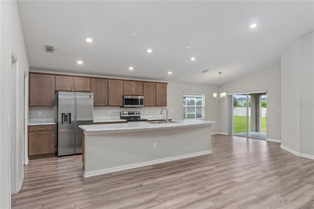 11958 Stone Pine St, Riverview, FL 33569 - kitchen with stainless steel appliances, light countertops, light wood finished floors, a center island with sink, and recessed lighting