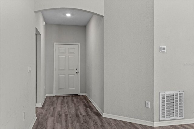 11958 Stone Pine St, Riverview, FL 33569 - hallway featuring arched walkways and dark wood-style floors