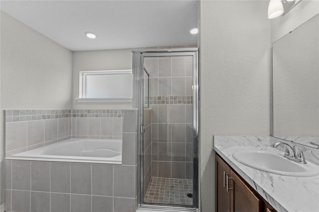 11958 Stone Pine St, Riverview, FL 33569 - full bathroom featuring vanity, a garden tub, and a shower stall