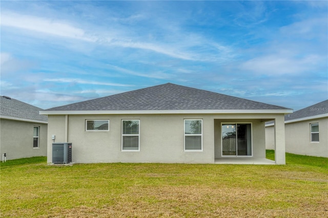 11958 Stone Pine St, Riverview, FL 33569 - rear view of house featuring a shingled roof, a lawn, stucco siding, and a patio area