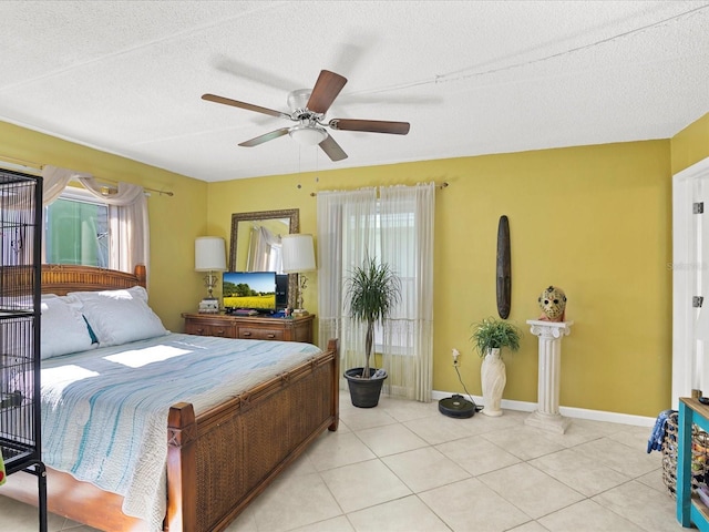 464 N Paula Dr Unit 106, Dunedin, FL 34698 - bedroom with a textured ceiling, light tile patterned flooring, and ceiling fan