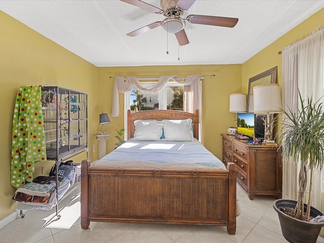 464 N Paula Dr Unit 106, Dunedin, FL 34698 - bedroom with a textured ceiling, light tile patterned flooring, and ceiling fan