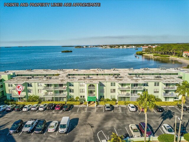 464 N Paula Dr Unit 106, Dunedin, FL 34698 - bird's eye view of a nearby body of water and apartment complex