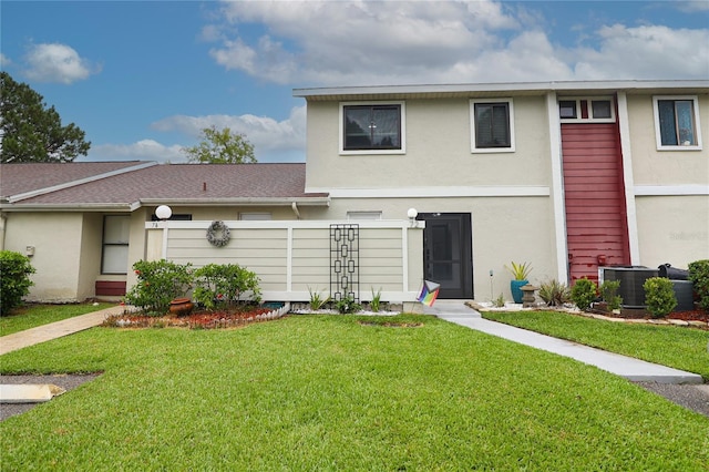 72 Pine Island Cir, Kissimmee, FL 34743 - rear view of house featuring stucco siding