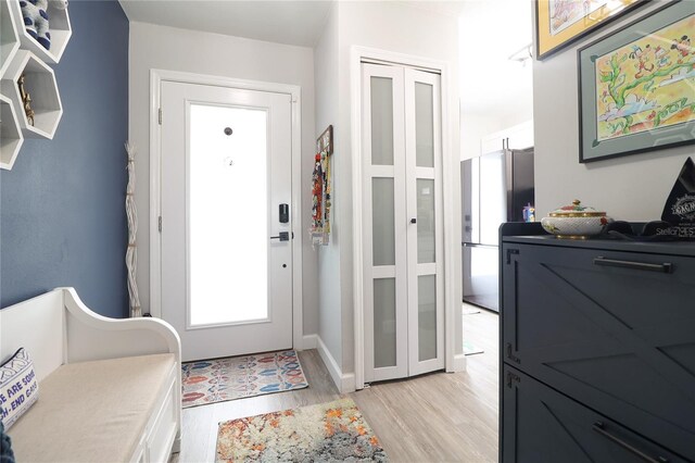 72 Pine Island Cir, Kissimmee, FL 34743 - foyer with light wood-style floors