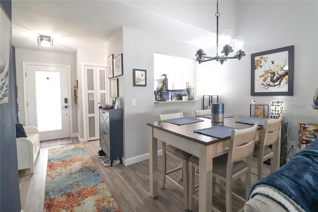 72 Pine Island Cir, Kissimmee, FL 34743 - dining space featuring a chandelier and wood finished floors