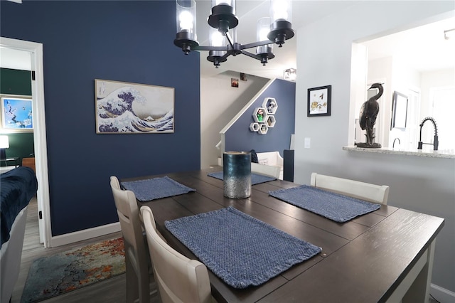 72 Pine Island Cir, Kissimmee, FL 34743 - dining room with a chandelier and wood finished floors