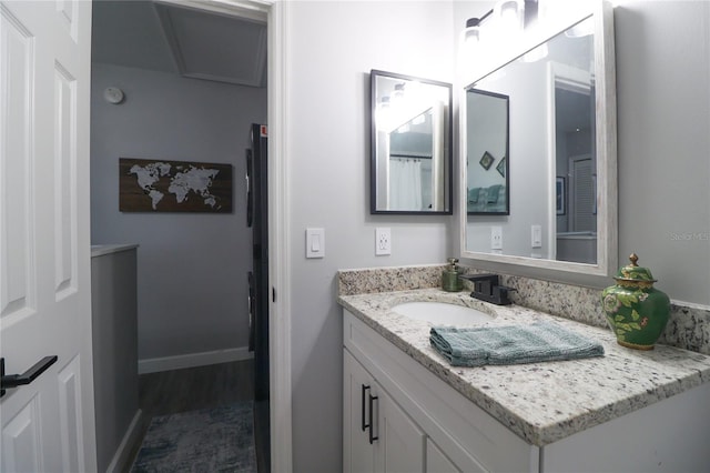 72 Pine Island Cir, Kissimmee, FL 34743 - full bath featuring vanity and wood finished floors