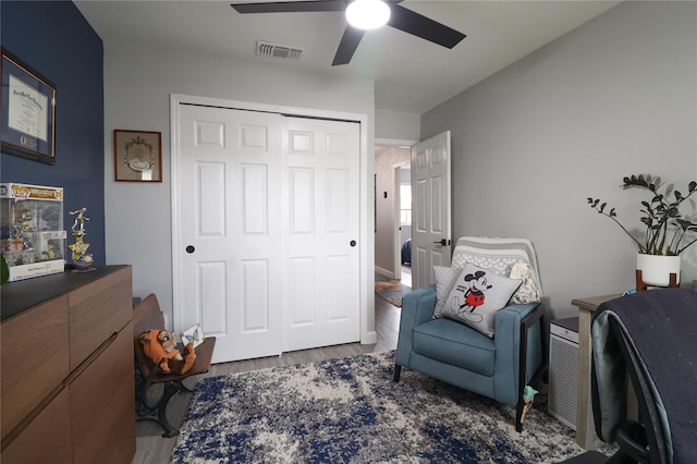 72 Pine Island Cir, Kissimmee, FL 34743 - sitting room featuring a ceiling fan and wood finished floors