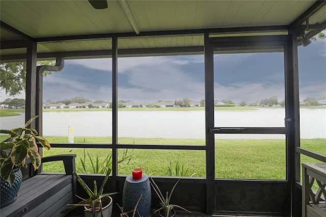 72 Pine Island Cir, Kissimmee, FL 34743 - sunroom featuring a water view