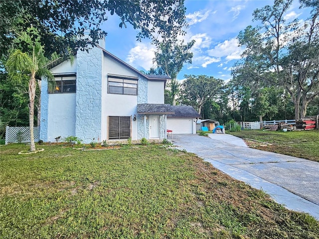 10928 Echo Loop, New Port Richey, FL 34654 - view of front of property featuring stucco siding, a garage, and driveway