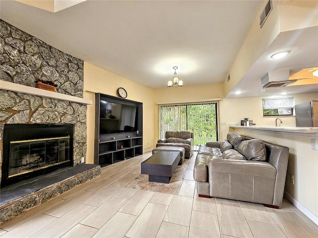 10928 Echo Loop, New Port Richey, FL 34654 - living room featuring a chandelier and a fireplace