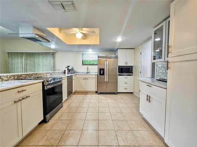 10928 Echo Loop, New Port Richey, FL 34654 - kitchen with stainless steel appliances, ceiling fan, backsplash, light countertops, and recessed lighting