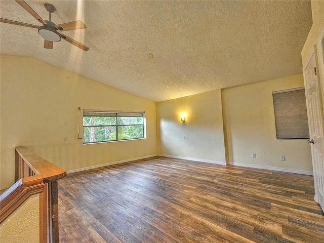 10928 Echo Loop, New Port Richey, FL 34654 - spare room featuring a textured ceiling, wood finished floors, a ceiling fan, and lofted ceiling