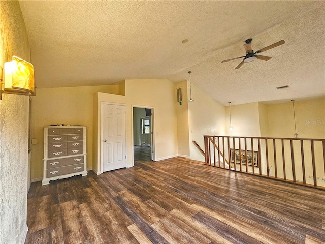 10928 Echo Loop, New Port Richey, FL 34654 - empty room featuring a ceiling fan, wood finished floors, a textured ceiling, and lofted ceiling