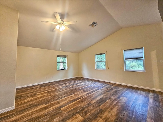 10928 Echo Loop, New Port Richey, FL 34654 - empty room with dark wood-style flooring, a ceiling fan, and lofted ceiling