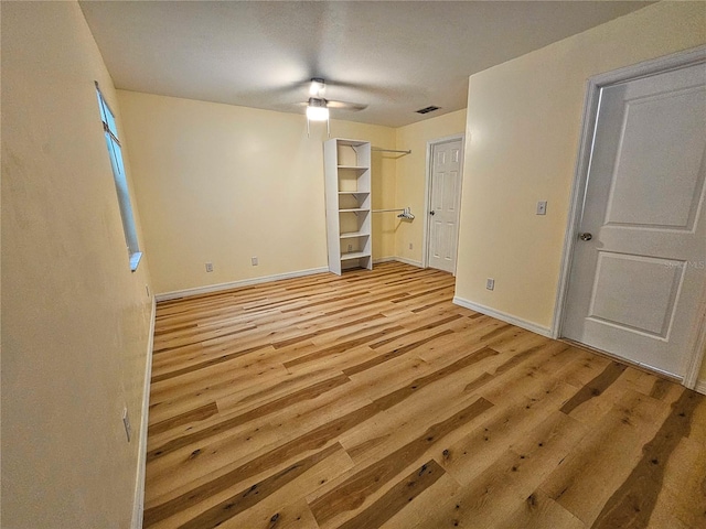 10928 Echo Loop, New Port Richey, FL 34654 - empty room with light wood-style flooring and baseboards