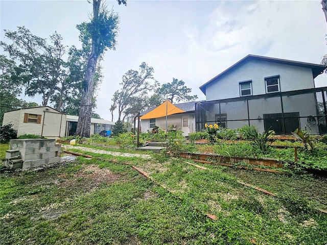 10928 Echo Loop, New Port Richey, FL 34654 - view of yard with glass enclosure and a shed