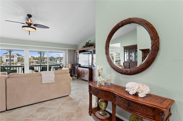 131 N Tessier Dr, St Pete Beach, FL 33706 - living room with a ceiling fan, lofted ceiling, and a textured wall