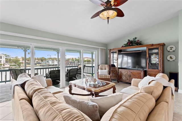 131 N Tessier Dr, St Pete Beach, FL 33706 - living room featuring lofted ceiling, a ceiling fan, and light tile patterned floors