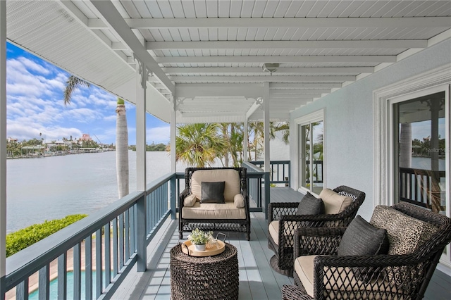131 N Tessier Dr, St Pete Beach, FL 33706 - balcony with a water view and an outdoor hangout area