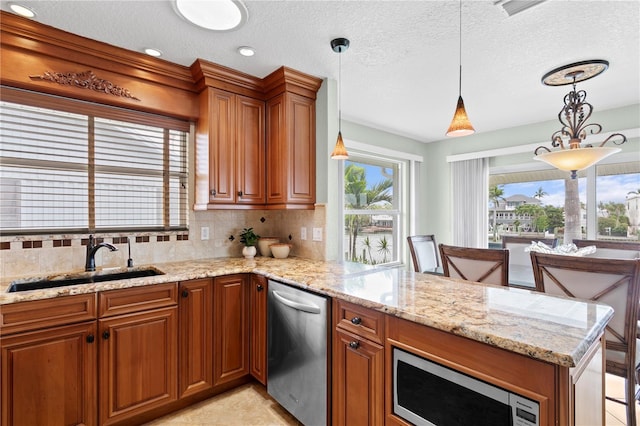 131 N Tessier Dr, St Pete Beach, FL 33706 - kitchen featuring appliances with stainless steel finishes, a peninsula, brown cabinets, tasteful backsplash, and a textured ceiling