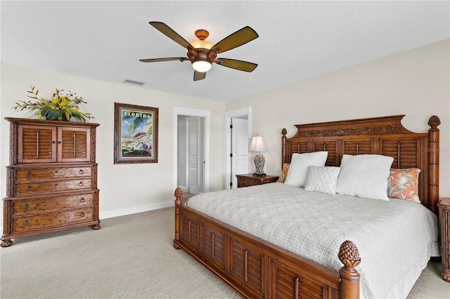 131 N Tessier Dr, St Pete Beach, FL 33706 - bedroom with light colored carpet and ceiling fan