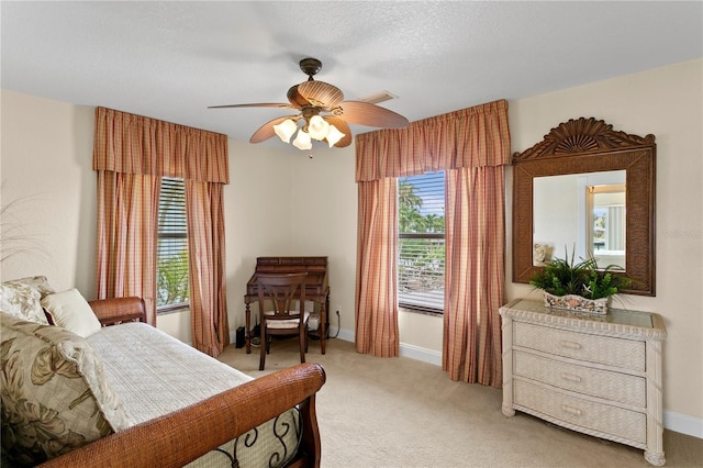 131 N Tessier Dr, St Pete Beach, FL 33706 - bedroom with light colored carpet and a ceiling fan