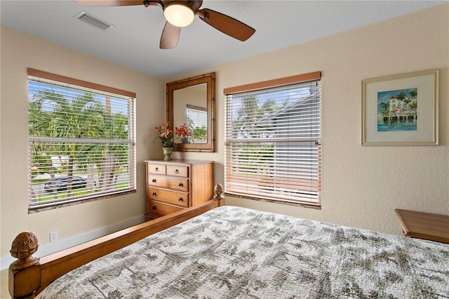 131 N Tessier Dr, St Pete Beach, FL 33706 - bedroom featuring a ceiling fan and a textured wall