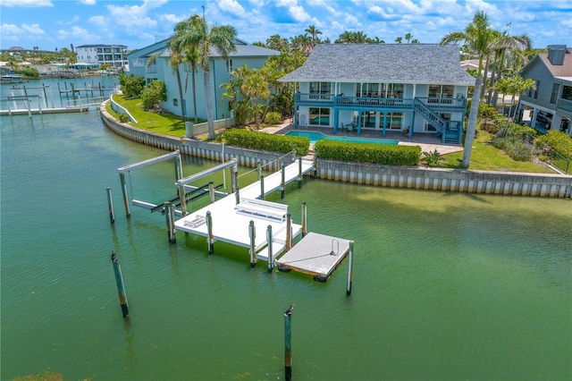 131 N Tessier Dr, St Pete Beach, FL 33706 - dock area with a water view, boat lift, stairs, a balcony, and a patio